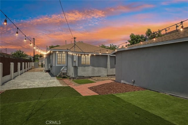 2422 E 115th St, Los Angeles, CA 90059 - back of property with a patio area and stucco siding