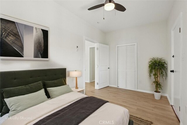 2422 E 115th St, Los Angeles, CA 90059 - bedroom featuring wood finished floors, a closet, and a ceiling fan