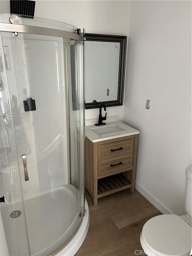 1350 Pleasant View Ave, Corona, CA 92882 - bathroom with wood finished floors, a shower stall, and vanity