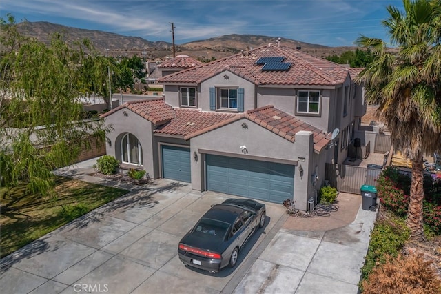 39269 Clear View Ct, Palmdale, CA 93551 - mediterranean / spanish home with stucco siding, driveway, a garage, a mountain view, and a gate