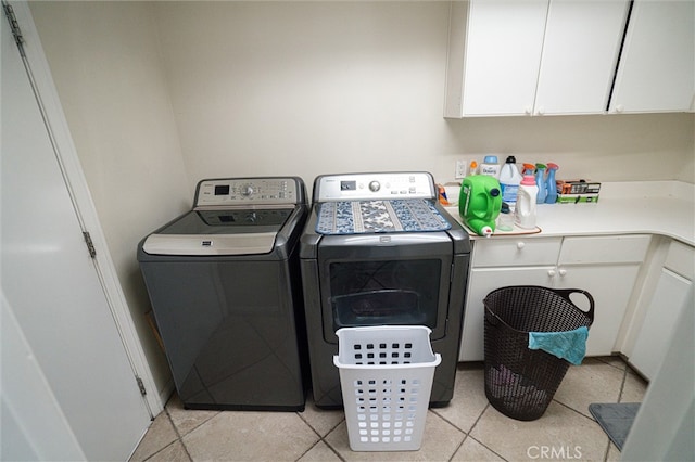 39269 Clear View Ct, Palmdale, CA 93551 - washroom featuring washer and clothes dryer, cabinet space, and light tile patterned flooring