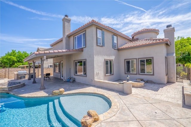 39269 Clear View Ct, Palmdale, CA 93551 - rear view of house featuring area for grilling, a chimney, a patio, and a tiled roof