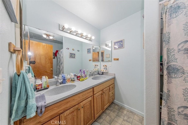 35095 Rough Rider Way, Raymond, CA 93653 - full bathroom featuring double vanity and baseboards
