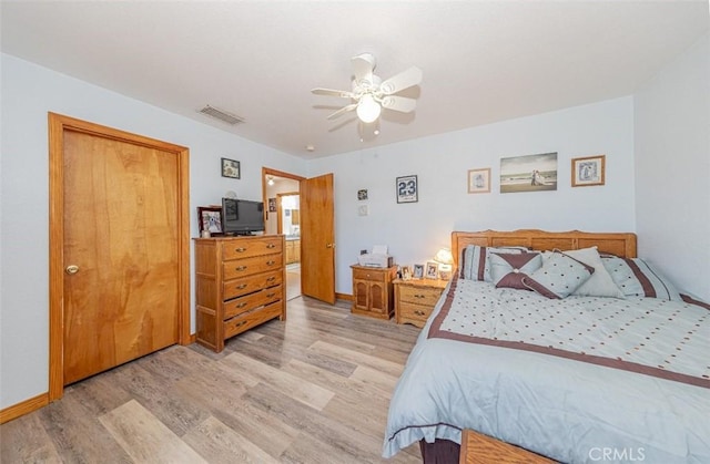 35095 Rough Rider Way, Raymond, CA 93653 - bedroom with light wood finished floors and a ceiling fan