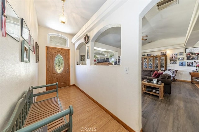 35095 Rough Rider Way, Raymond, CA 93653 - entrance foyer featuring wood finished floors, arched walkways, ceiling fan, and vaulted ceiling