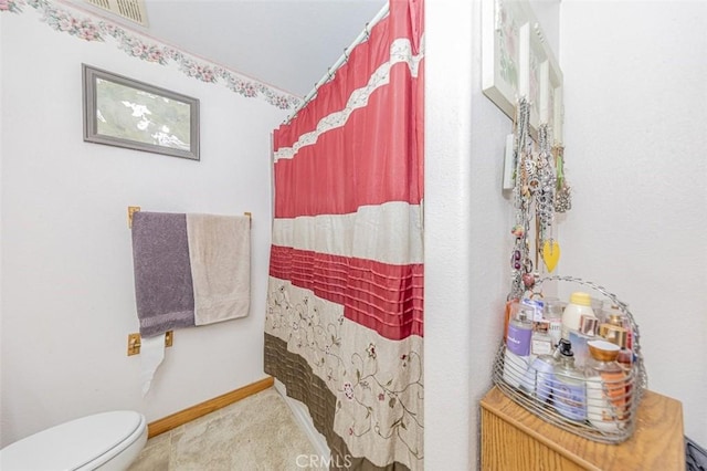 35095 Rough Rider Way, Raymond, CA 93653 - bathroom with toilet and a shower with shower curtain