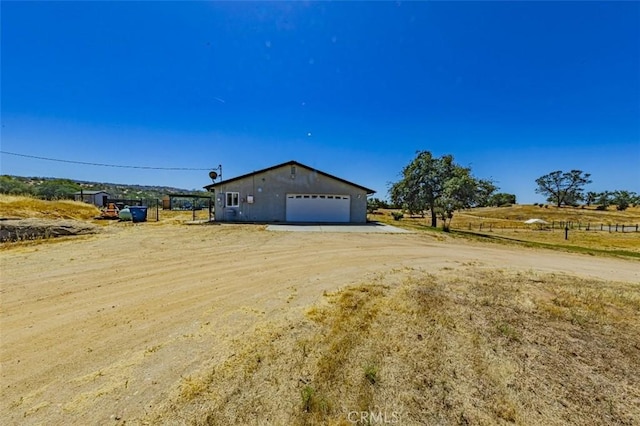 35095 Rough Rider Way, Raymond, CA 93653 - view of front of property featuring a garage and an outdoor structure