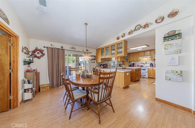 35095 Rough Rider Way, Raymond, CA 93653 - dining space featuring light wood-style flooring, lofted ceiling, and a chandelier