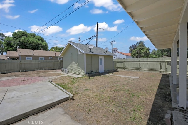12950 7th St, Chino, CA 91710 - fenced backyard with a patio and an outbuilding