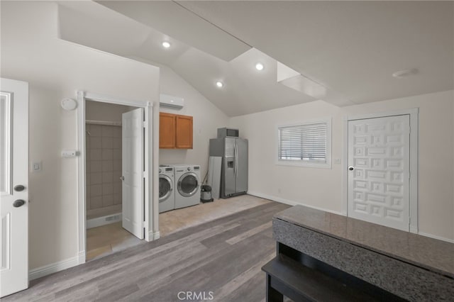 12950 7th St, Chino, CA 91710 - washroom featuring separate washer and dryer, an AC wall unit, light wood finished floors, cabinet space, and recessed lighting