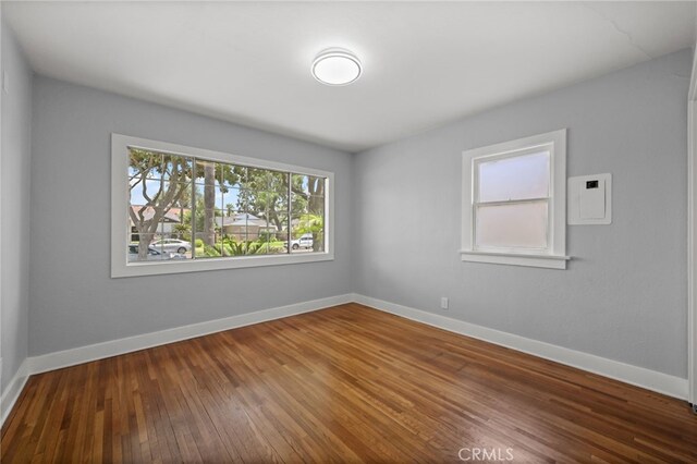 12950 7th St, Chino, CA 91710 - spare room featuring hardwood / wood-style floors and baseboards