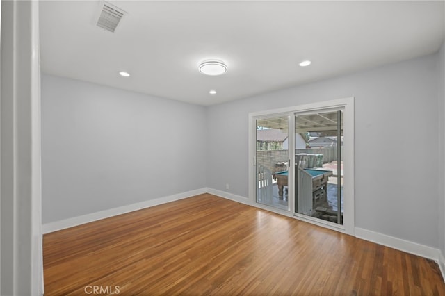 12950 7th St, Chino, CA 91710 - empty room featuring wood finished floors and recessed lighting