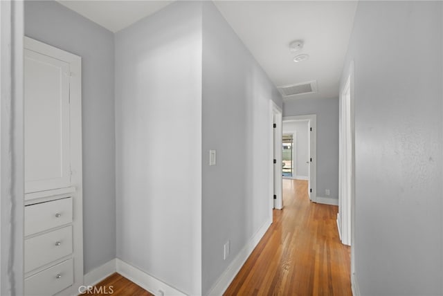 12950 7th St, Chino, CA 91710 - hallway featuring light wood-style floors and attic access