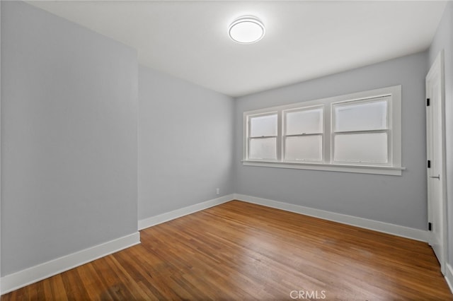 12950 7th St, Chino, CA 91710 - empty room with baseboards and wood finished floors