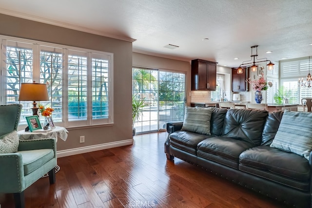 24813 Sagecrest Cir, Stevenson Ranch, CA 91381 - living area featuring crown molding, dark wood-style floors, and a textured ceiling