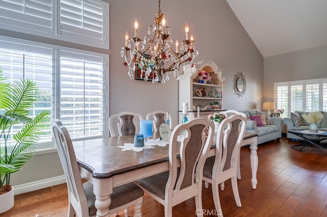 24813 Sagecrest Cir, Stevenson Ranch, CA 91381 - dining space featuring high vaulted ceiling, a chandelier, and wood finished floors