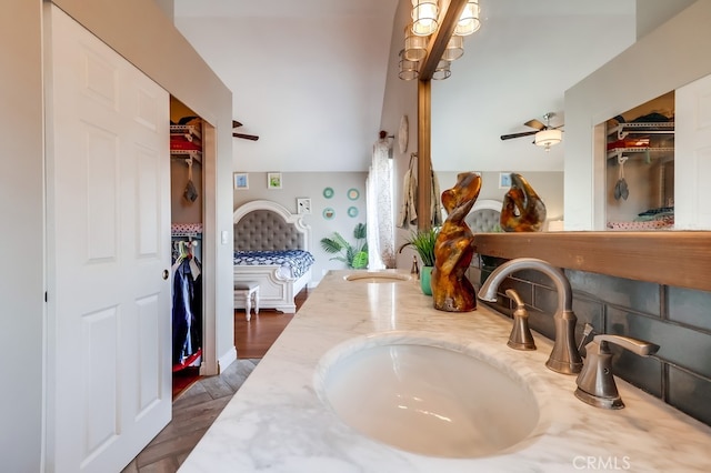 24813 Sagecrest Cir, Stevenson Ranch, CA 91381 - detailed view of double vanity, a spacious closet, bar, a ceiling fan, and wood finished floors