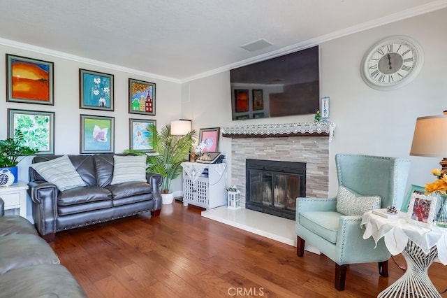 24813 Sagecrest Cir, Stevenson Ranch, CA 91381 - living room featuring ornamental molding, wood finished floors, and a tiled fireplace