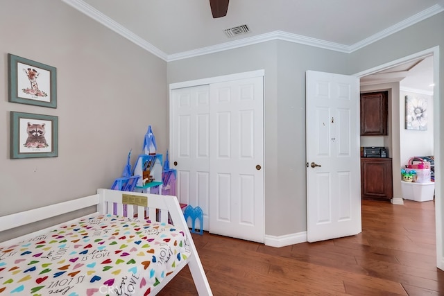 24813 Sagecrest Cir, Stevenson Ranch, CA 91381 - bedroom with dark wood-style flooring, a closet, ornamental molding, and a ceiling fan