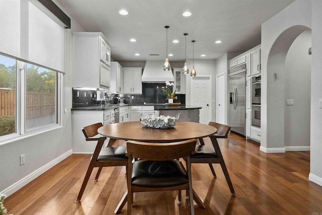 2830 Paradise Ridge Ct, Chula Vista, CA 91915 - dining area featuring recessed lighting, arched walkways, and dark wood finished floors