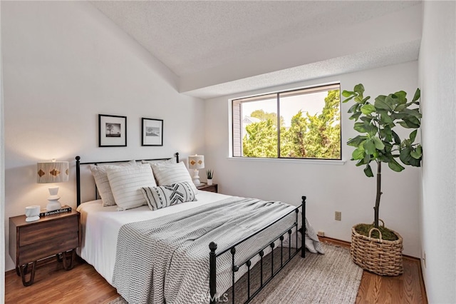 407 Mountain Laurel Ct, Mountain View, CA 94043 - bedroom with wood finished floors, lofted ceiling, and a textured ceiling