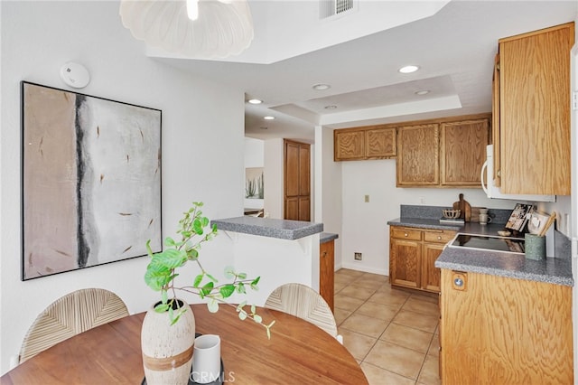 407 Mountain Laurel Ct, Mountain View, CA 94043 - kitchen with dark countertops, light tile patterned floors, range, a raised ceiling, and recessed lighting