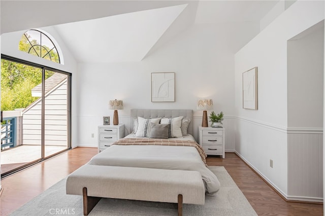 407 Mountain Laurel Ct, Mountain View, CA 94043 - bedroom featuring access to exterior, wood finished floors, high vaulted ceiling, and wainscoting