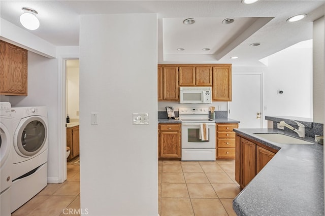 407 Mountain Laurel Ct, Mountain View, CA 94043 - kitchen featuring white appliances, light tile patterned floors, washer and dryer, brown cabinetry, and recessed lighting