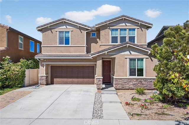 531 Owens River Dr, Oxnard, CA 93036 - craftsman-style house with stone siding, an attached garage, stucco siding, and driveway