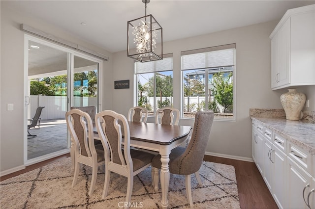 531 Owens River Dr, Oxnard, CA 93036 - dining space with a chandelier and dark wood finished floors