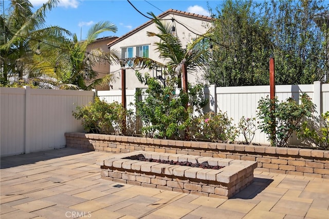 531 Owens River Dr, Oxnard, CA 93036 - fenced backyard with a patio and an outdoor fire pit
