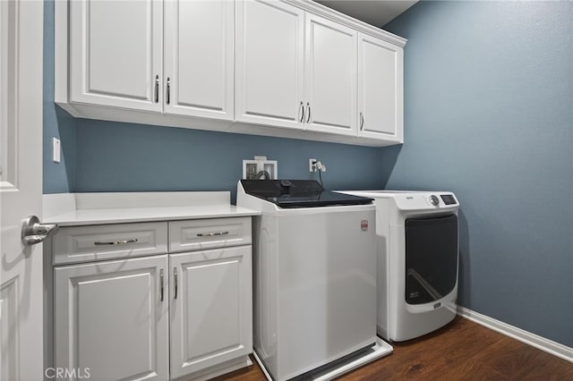 531 Owens River Dr, Oxnard, CA 93036 - laundry room featuring cabinet space, washer and clothes dryer, and dark wood-style flooring