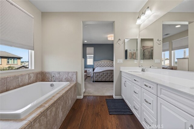 531 Owens River Dr, Oxnard, CA 93036 - bathroom featuring ensuite bath, wood finished floors, vanity, and healthy amount of natural light