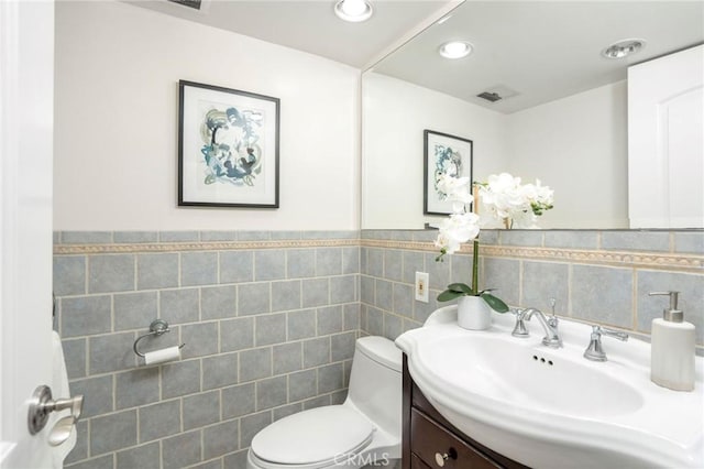 105 Via Capay, Palos Verdes Estates, CA 90274 - half bathroom featuring tile walls, vanity, and a wainscoted wall