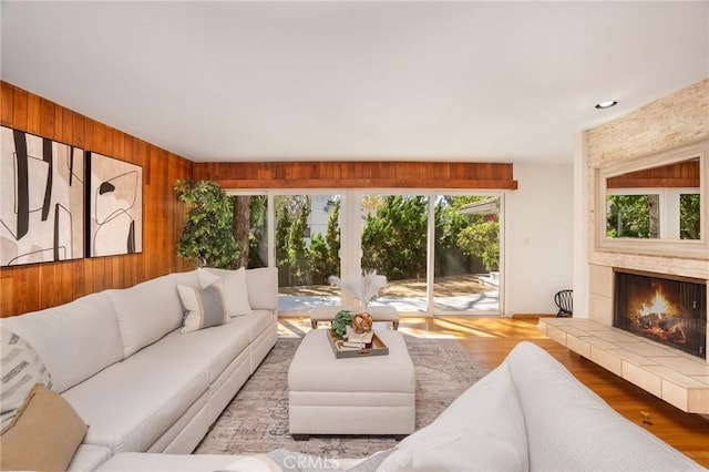 105 Via Capay, Palos Verdes Estates, CA 90274 - living area with plenty of natural light, a fireplace, wooden walls, and wood finished floors
