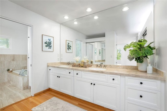 105 Via Capay, Palos Verdes Estates, CA 90274 - bathroom featuring double vanity, wood finished floors, a garden tub, and recessed lighting