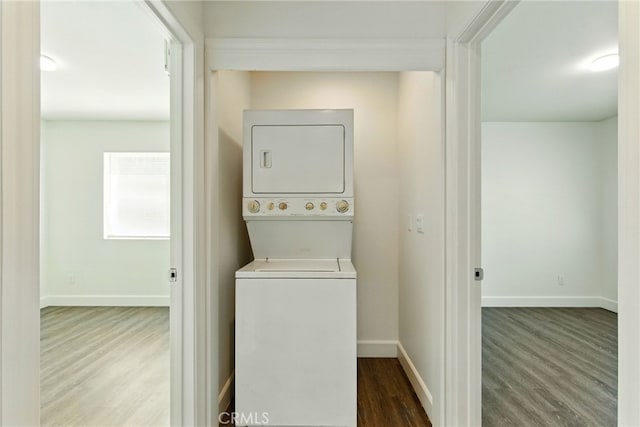 4041 57th St, Sacramento, CA 95820 - laundry room with stacked washer / dryer and wood finished floors