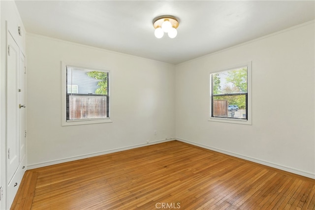 4041 57th St, Sacramento, CA 95820 - empty room featuring light wood-type flooring and crown molding