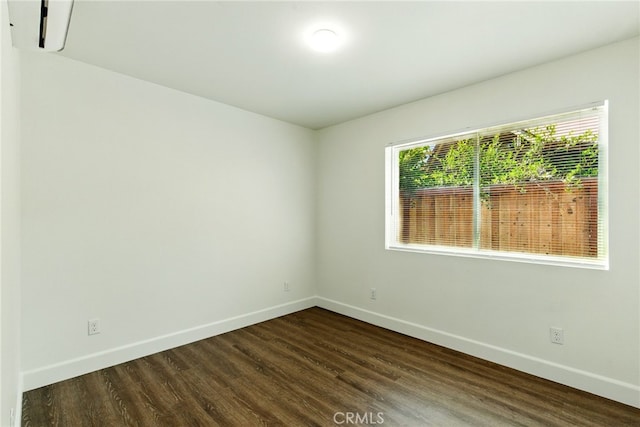4041 57th St, Sacramento, CA 95820 - unfurnished room with baseboards and dark wood-style flooring