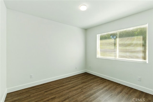 4041 57th St, Sacramento, CA 95820 - empty room with baseboards and dark wood-style flooring