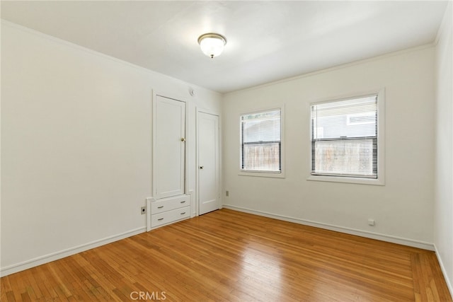 4041 57th St, Sacramento, CA 95820 - unfurnished bedroom featuring light wood-style floors and ornamental molding
