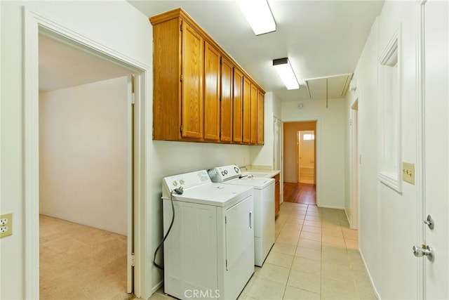 4041 57th St, Sacramento, CA 95820 - laundry room featuring attic access, cabinet space, independent washer and dryer, and light tile patterned flooring