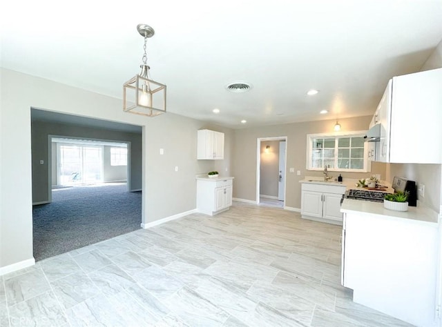 429 N Peg St, Ridgecrest, CA 93555 - kitchen featuring light countertops, white cabinetry, range, pendant lighting, and recessed lighting