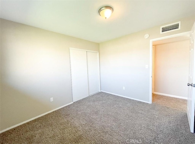 429 N Peg St, Ridgecrest, CA 93555 - unfurnished bedroom featuring carpet flooring and a closet