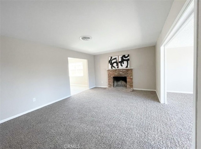 429 N Peg St, Ridgecrest, CA 93555 - unfurnished living room featuring carpet flooring and a brick fireplace