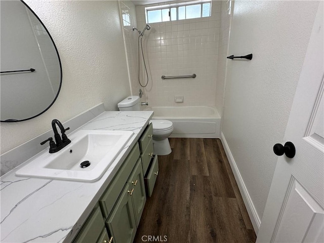 899 La Jolla Way, Merced, CA 95348 - full bath with vanity, wood finished floors, a textured wall, and shower / bathtub combination