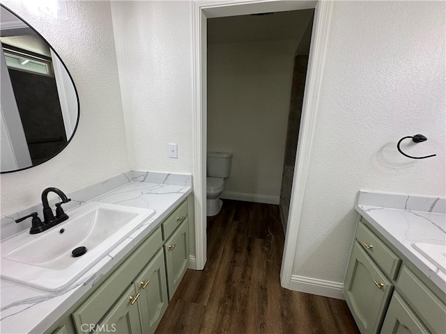 899 La Jolla Way, Merced, CA 95348 - full bathroom with vanity, wood finished floors, and a textured wall