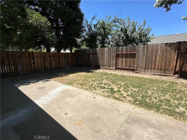 899 La Jolla Way, Merced, CA 95348 - fenced backyard with a patio