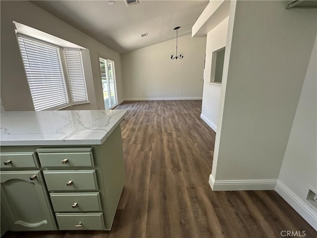 899 La Jolla Way, Merced, CA 95348 - unfurnished dining area featuring vaulted ceiling, dark wood-style floors, and a chandelier