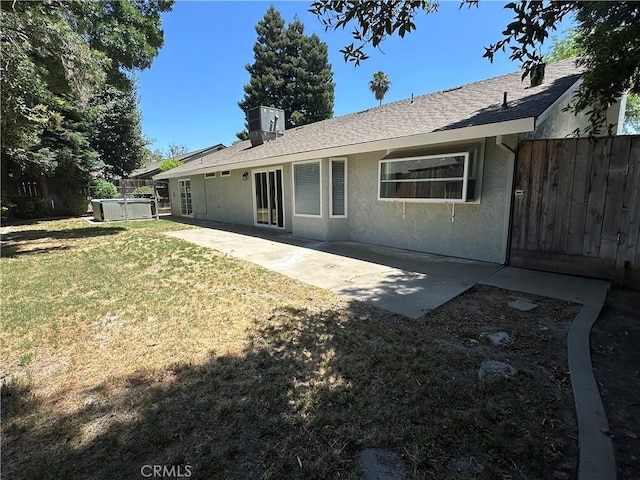 899 La Jolla Way, Merced, CA 95348 - rear view of house featuring a patio, stucco siding, and roof with shingles